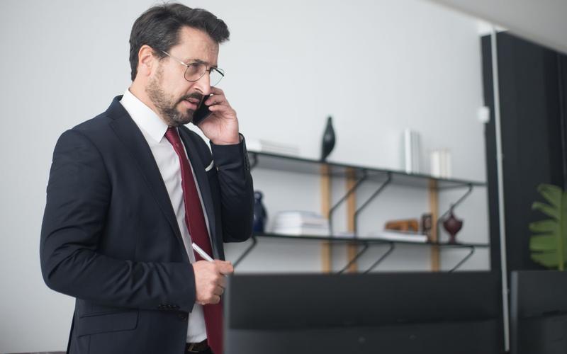 Office manager making a phone call
