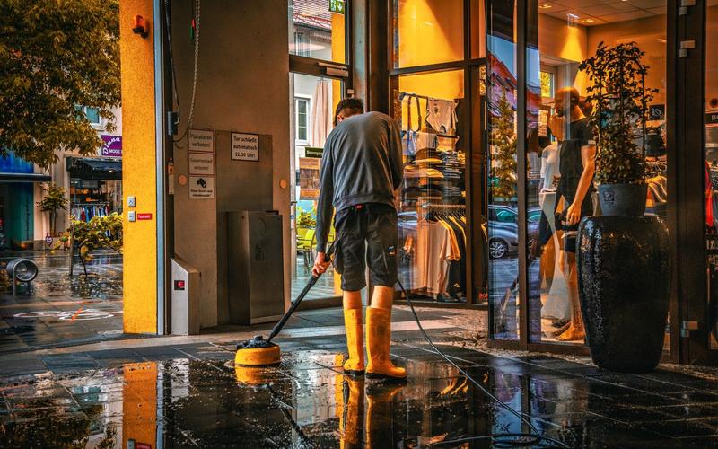 Shop entrance being pressure cleaned